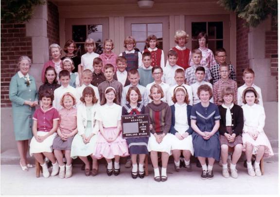Maple Leaf School Sixth Grade, June 1964. Teacher Miss Jane Dayton (in blue) and Principal Katherine Maxwell (pink.) Valarie is in the back row, far right end. Photo courtesy of Philip Cereghino.